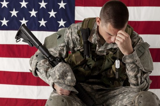 soldier in front of flag-small